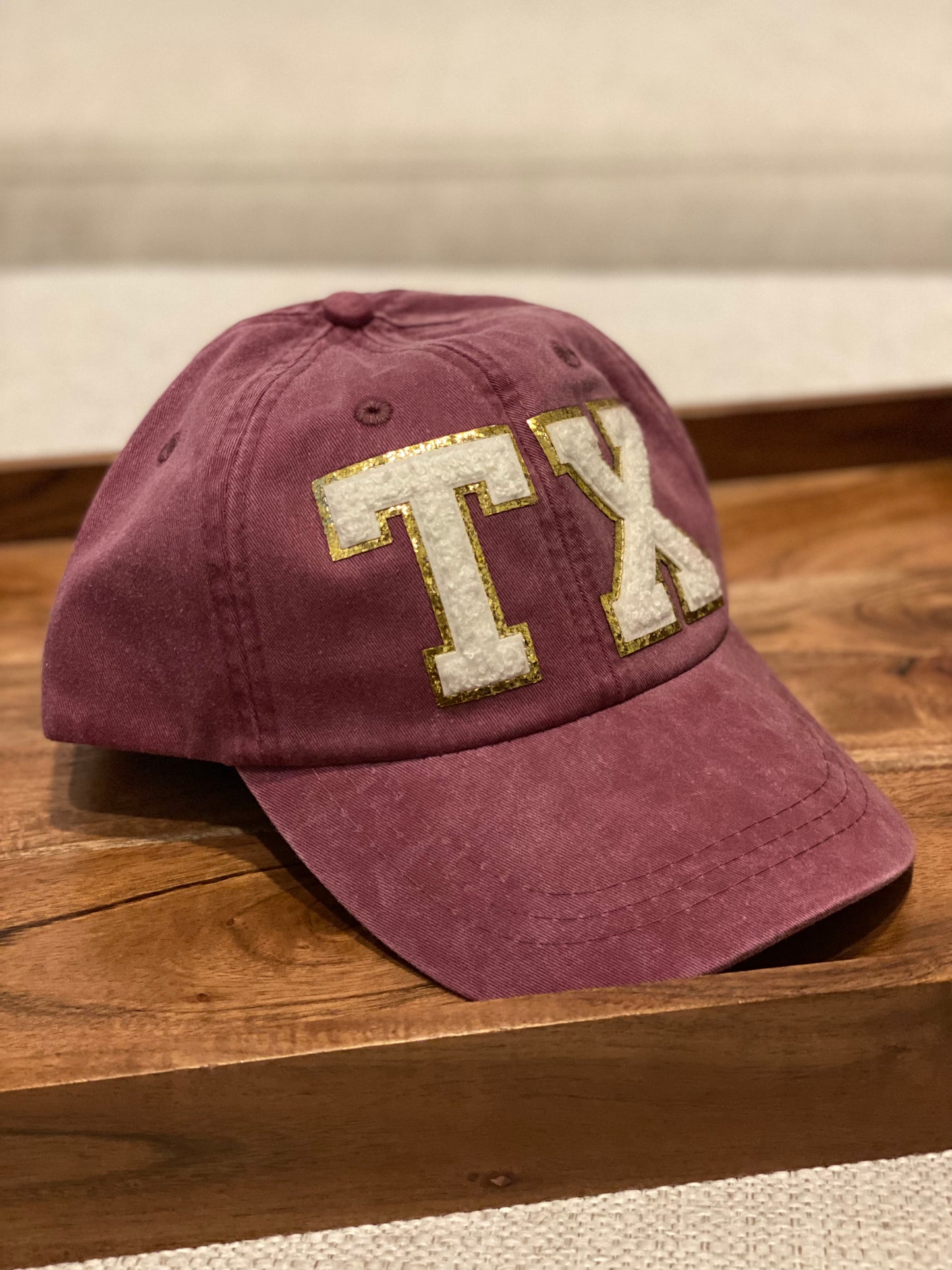 TX maroon baseball cap