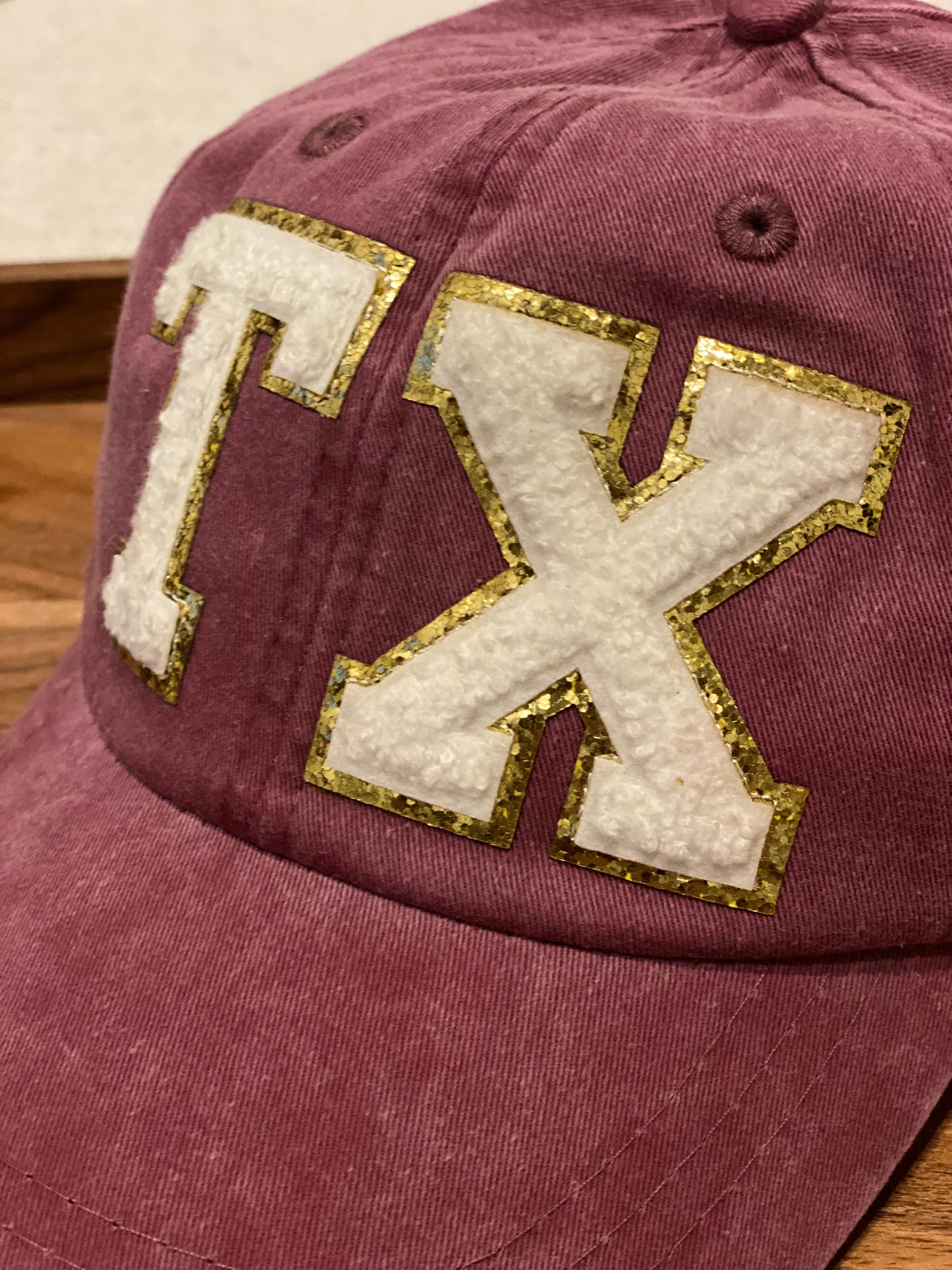 TX maroon baseball cap